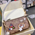 Coach Nolita 19 in Signature Canvas with Patches