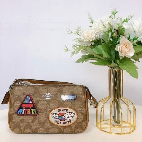 Coach Nolita 19 in Signature Canvas with Patches