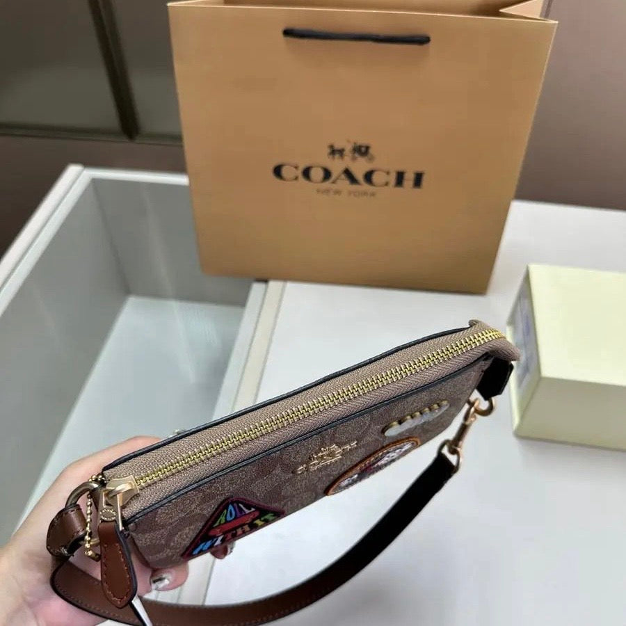 Coach Nolita 19 in Signature Canvas with Patches
